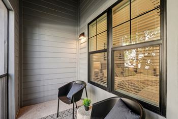 A chair sits on a porch